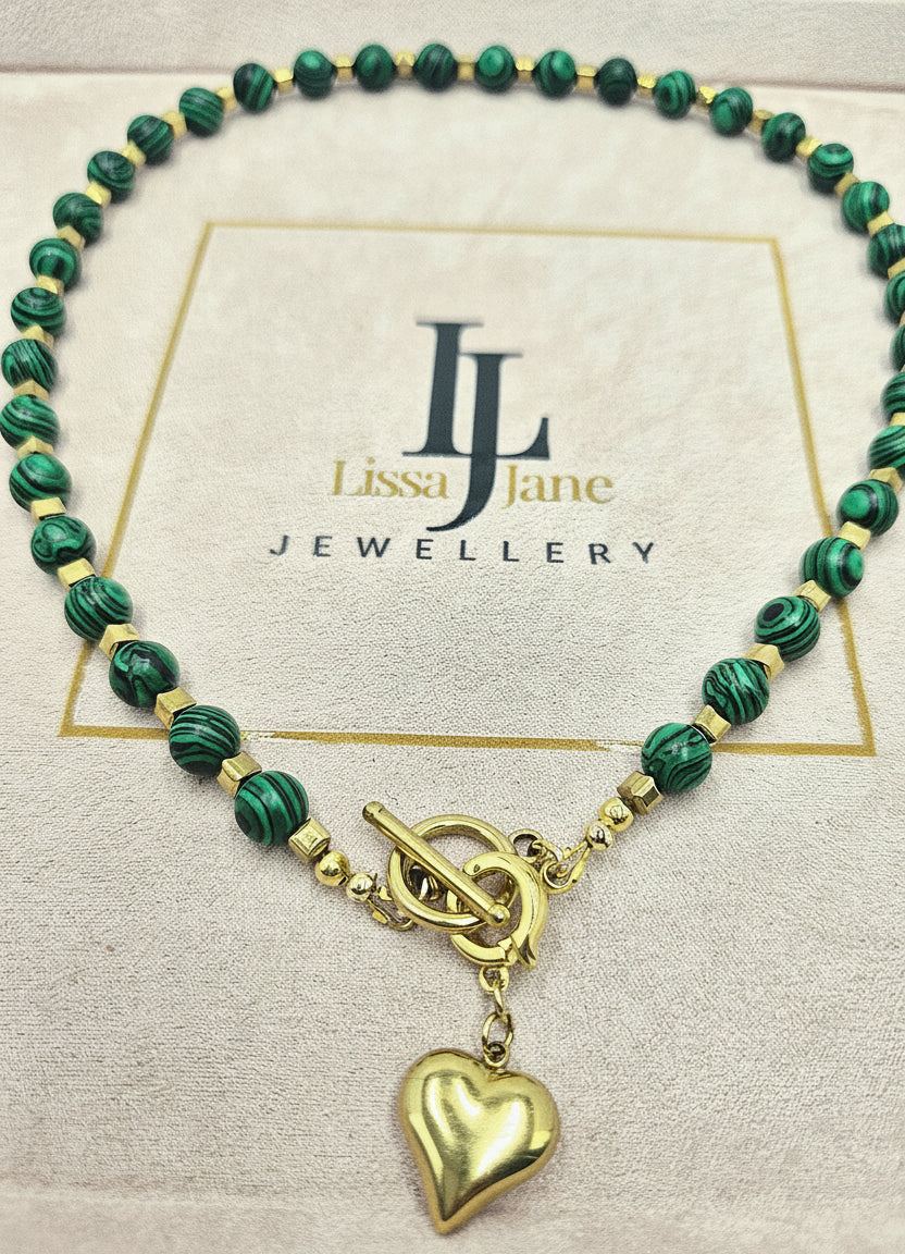 Malachite and square gold haematite beaded necklace with removable ion plated heart pendant and toggle clasp, displayed on a Lissa Jane Jewellery branded card