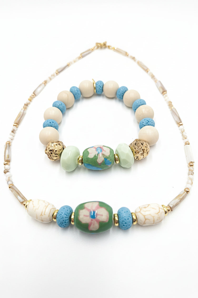 The Garden Story Necklace - upcycled ceramic floral bead with lava stone and shell beads