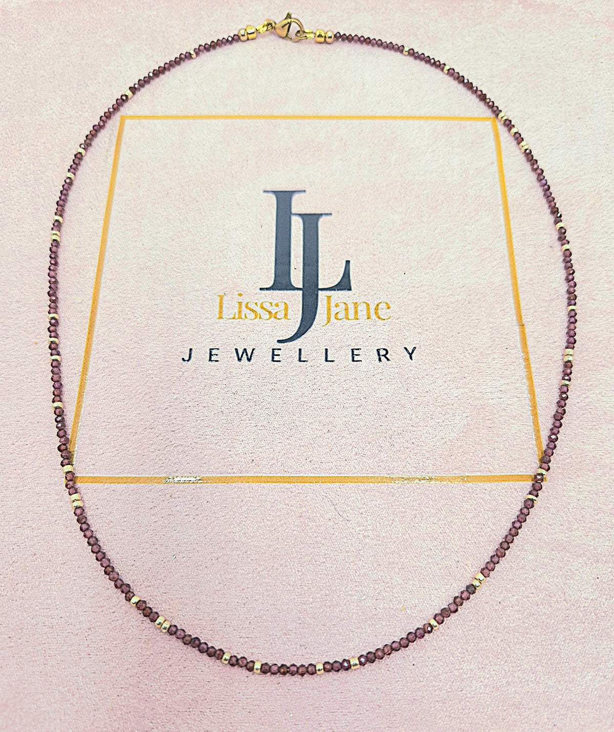 Garnet Heart Necklace - heart shaped display