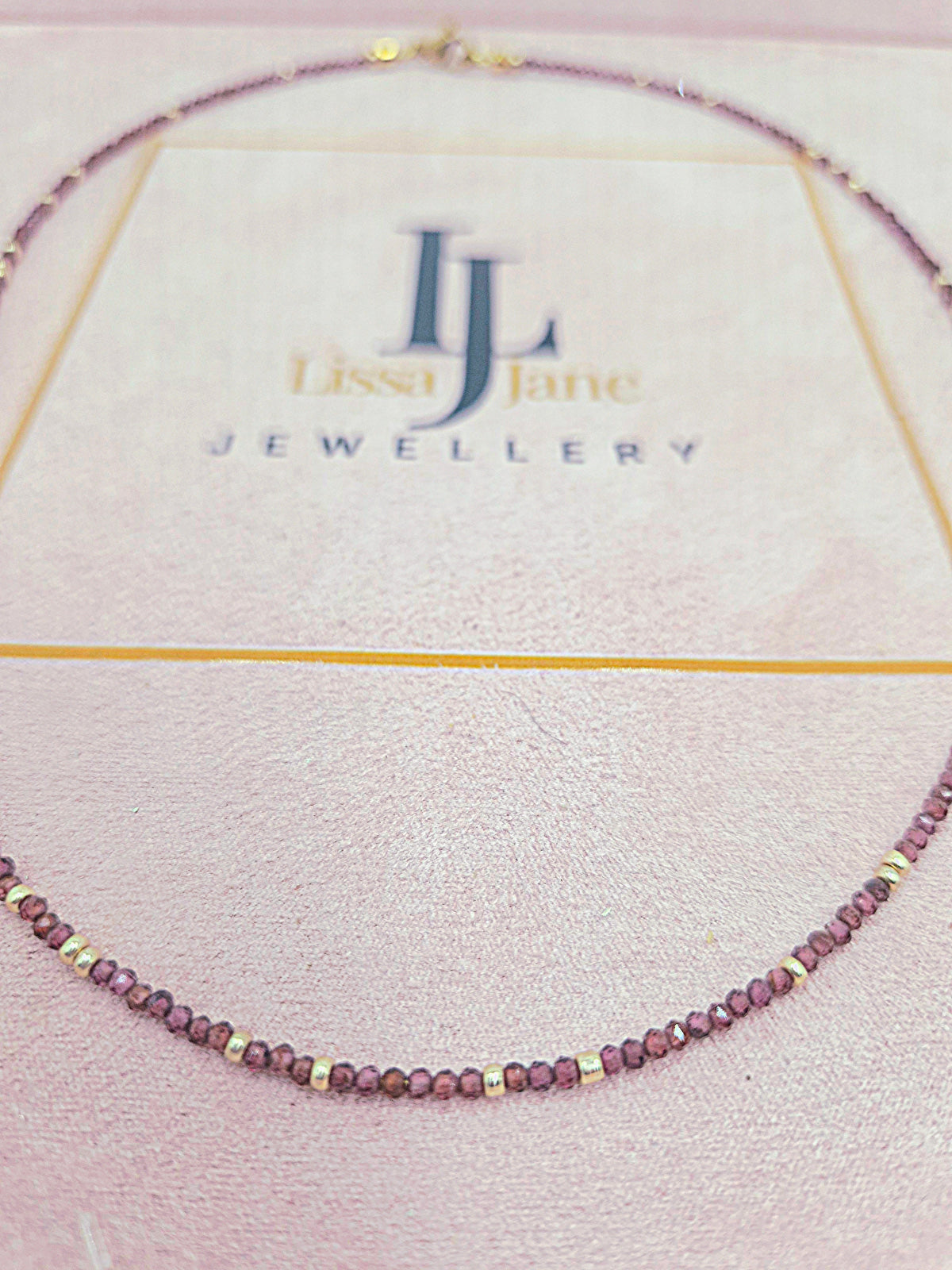 Garnet Heart Necklace - heart shaped display 3
