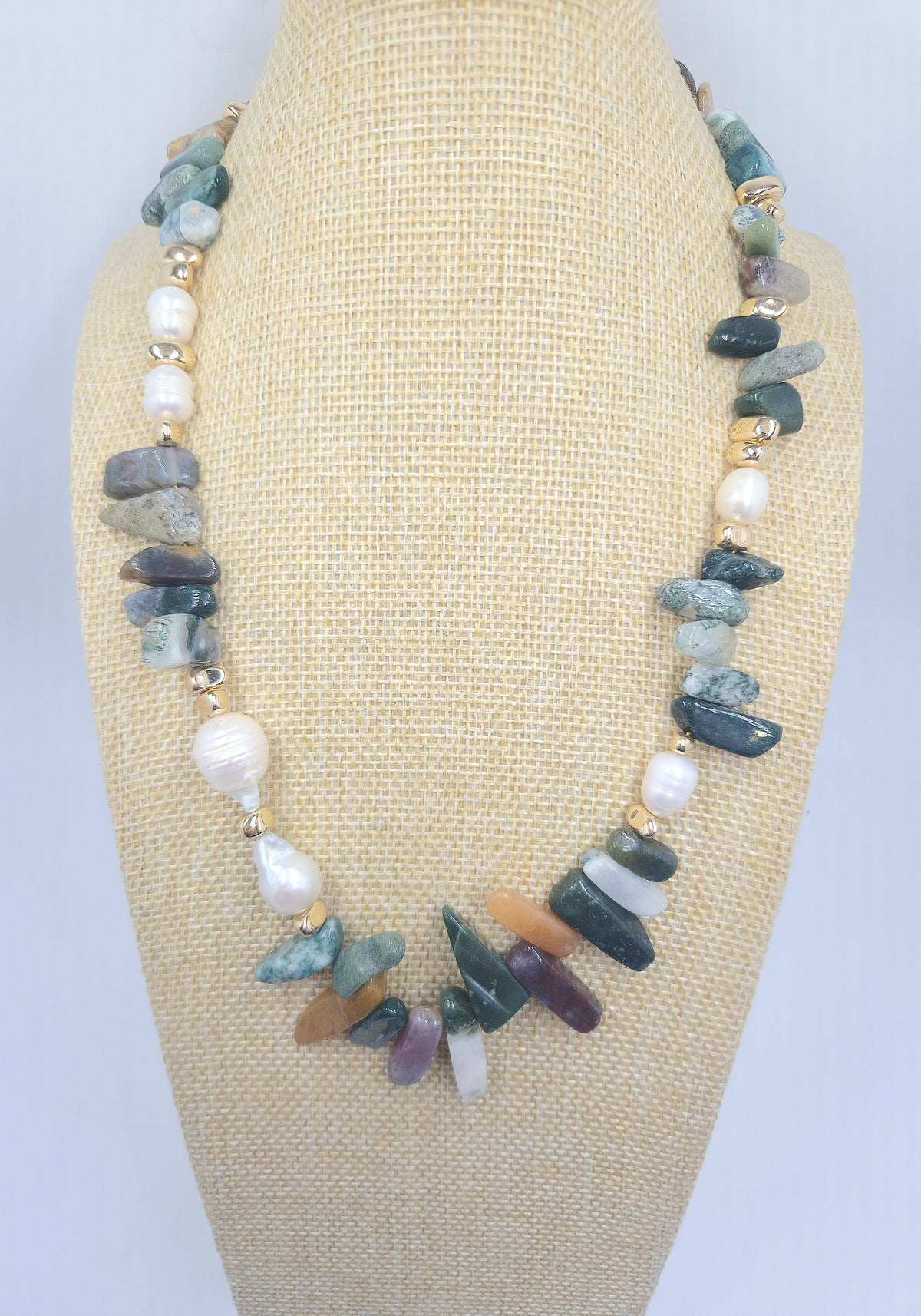 Detail of Indian agate, gold hematite and natural baroque pearl beads on a statement necklace