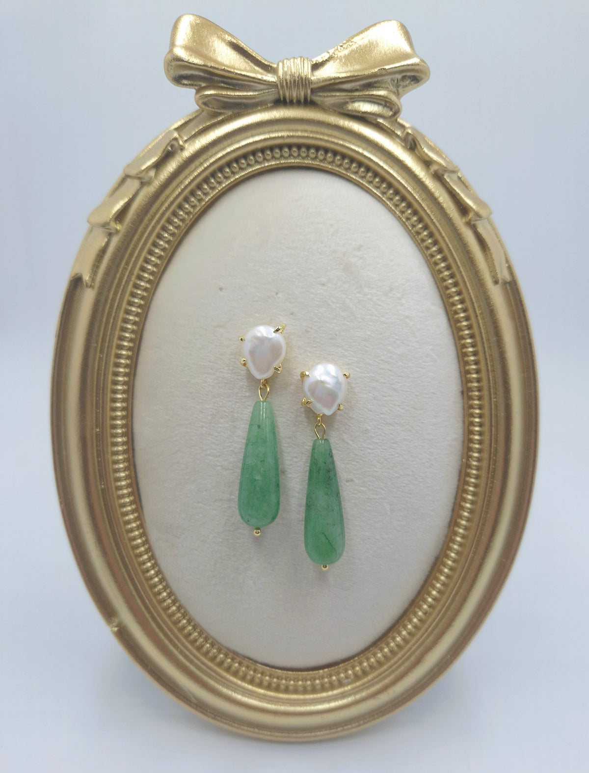 Close-up of pearl cushion studs and green aventurine drop beads