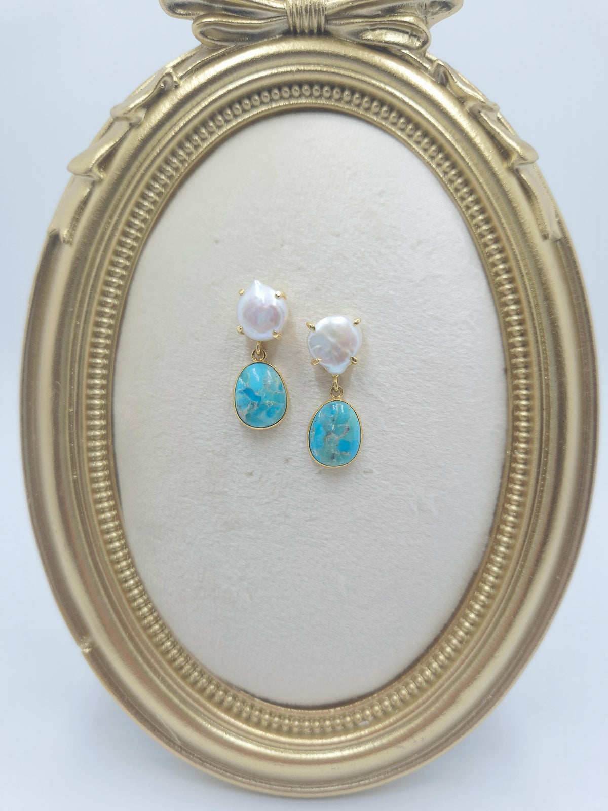 Pearl cushion stud earrings with oval Kingman turquoise drops in gold-plated bezels