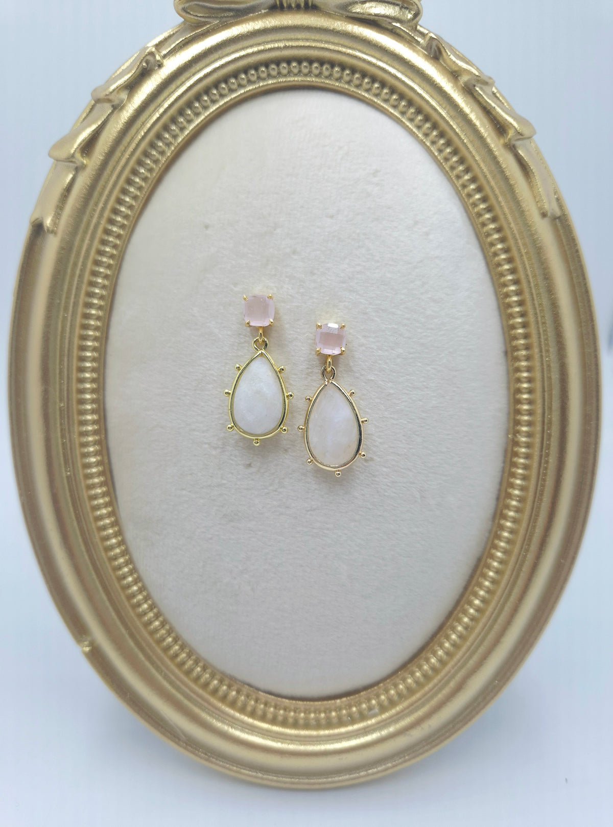 Pink chalcedony cushion studs with white crystal drops in open teardrop frames